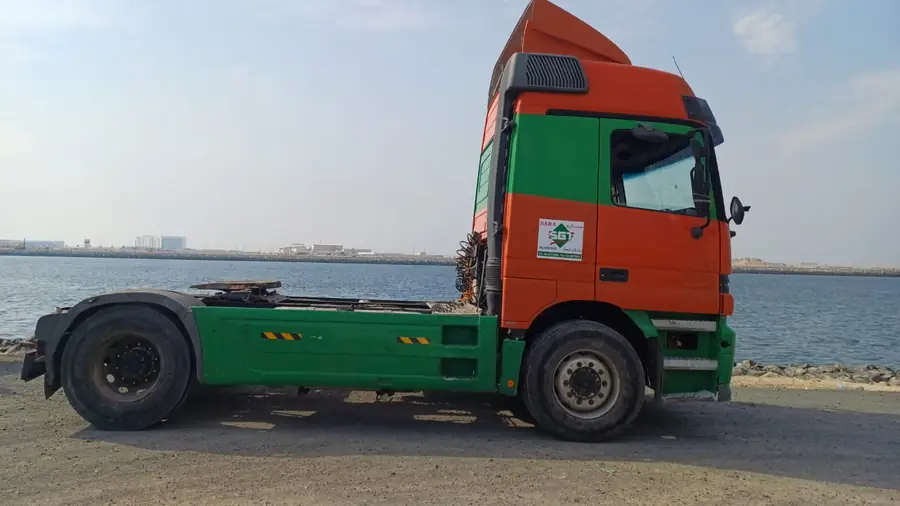 Sara General Land Transport flatbed extension truck prime mover parked at Dubai waterfront